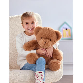 Mädchen mit braunem Teddybär, der eine persönliche Sprachnachricht abspielen kann.