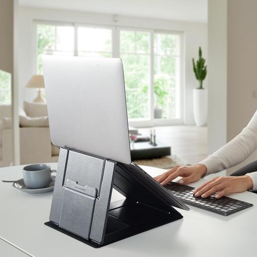 Faltbarer 5-in-1 Laptop-Ständer Der erste Sit & Stand-Halter für Laptops aller Art. Zusammengelegt ultraflach. In Sekunden nach Bedarf auf- und umgebaut. Ideal auch fürs mobile Arbeiten.