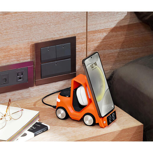 Oranger Qi-Lade-Stapler mit aufgeladenem Smartphone und digitaler Uhranzeige.