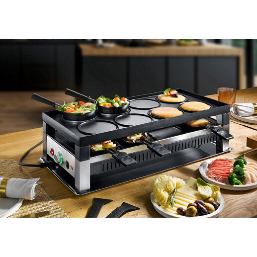 Solis Raclette- und Fun-Cooking 5-in-1 Gerät mit Gemüse und Fleisch auf dem Tisch.