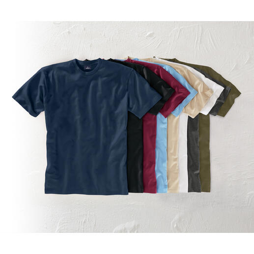 Verschiedene Farben von Das 155 g-Ragman T-Shirt auf einem Tisch.