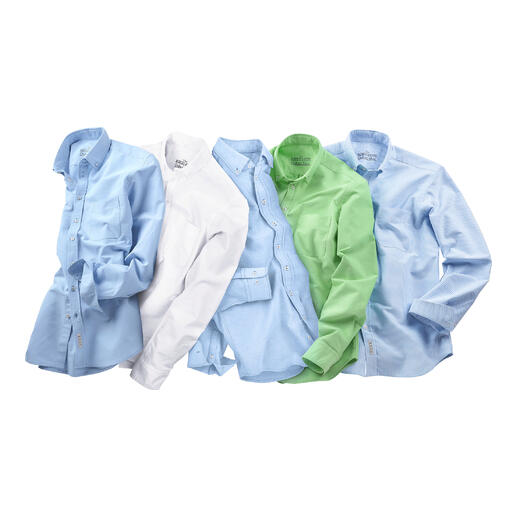 Mehrere BDO-Shirts in verschiedenen Farben auf einem Tisch.