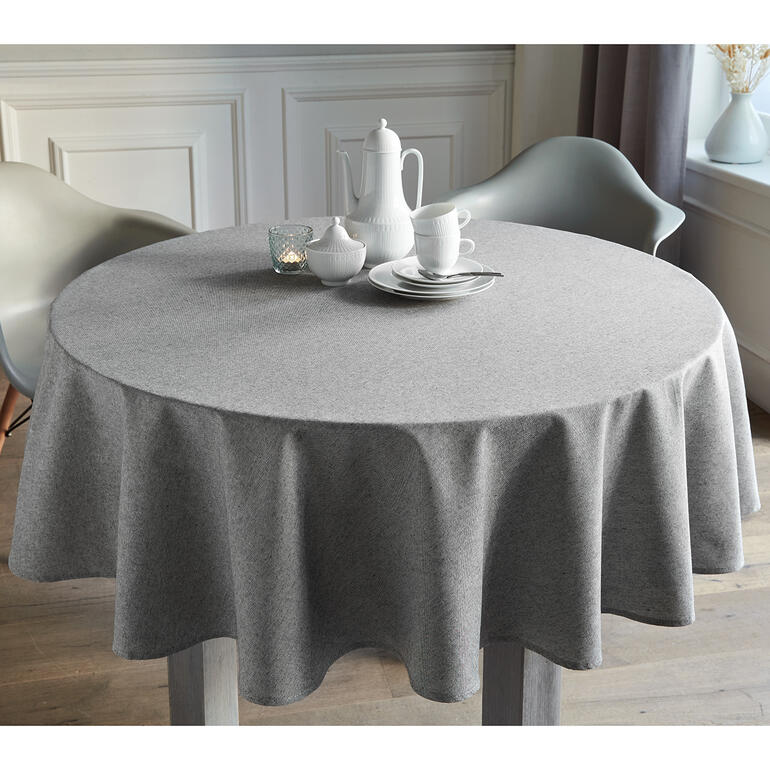 Mélange Naturel/Noir Graues, runde Tischdecke im Leinen-Look auf einem Tisch