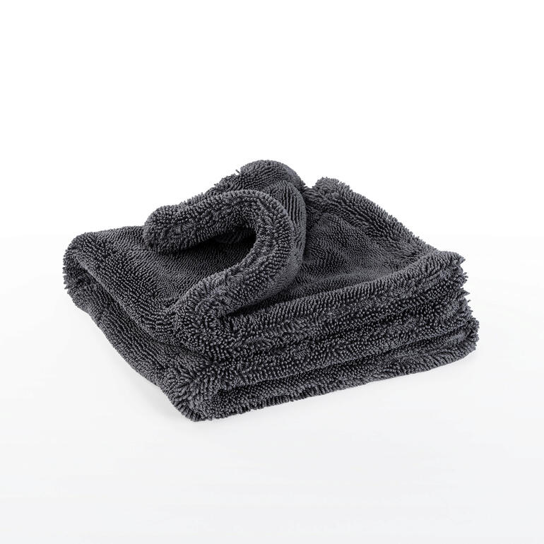 Faltbares Reinigungstuch in grauer Farbe, aufeinandergelegt.