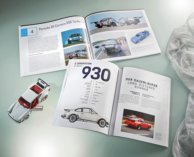 Bücher über Porsche mit Abbildungen und einem Modellauto.