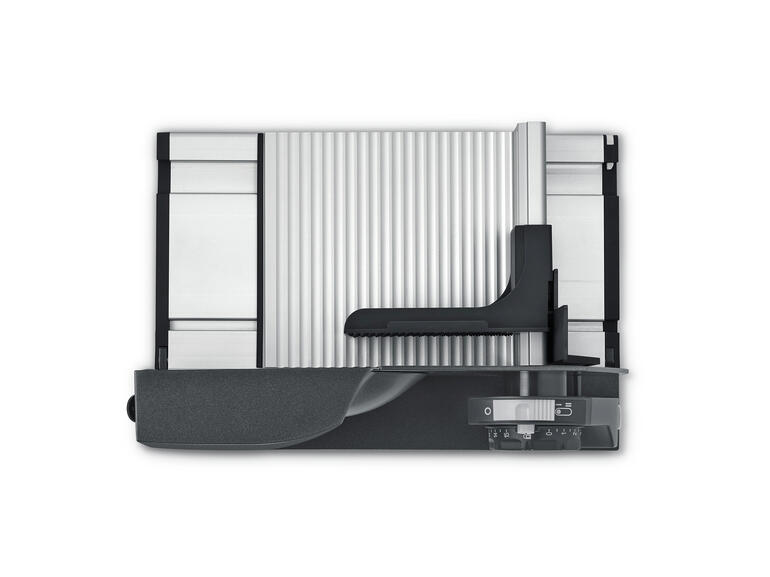 Ultrakompakter Allesschneider von oben mit Sicht auf das schneidbare Material.