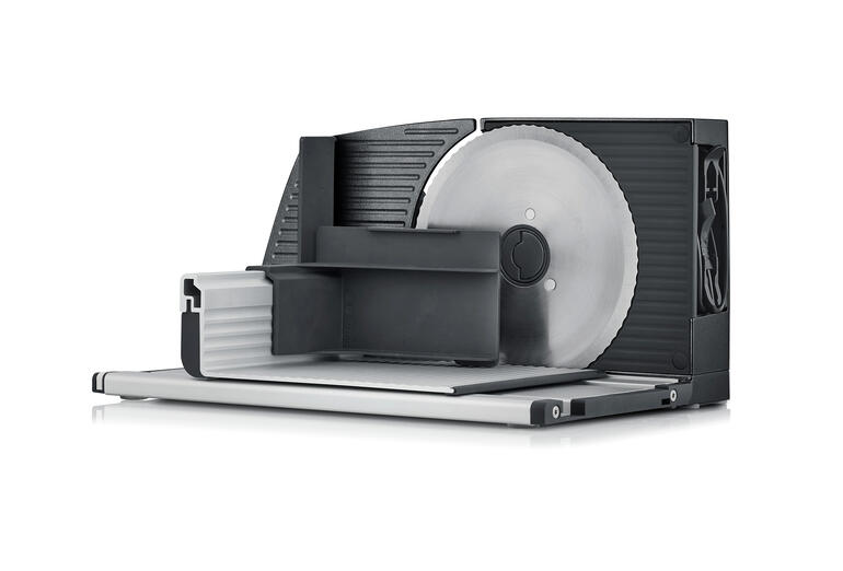 Ultrakompakter Allesschneider von der Seite mit sichtbarem Sägeblatt.