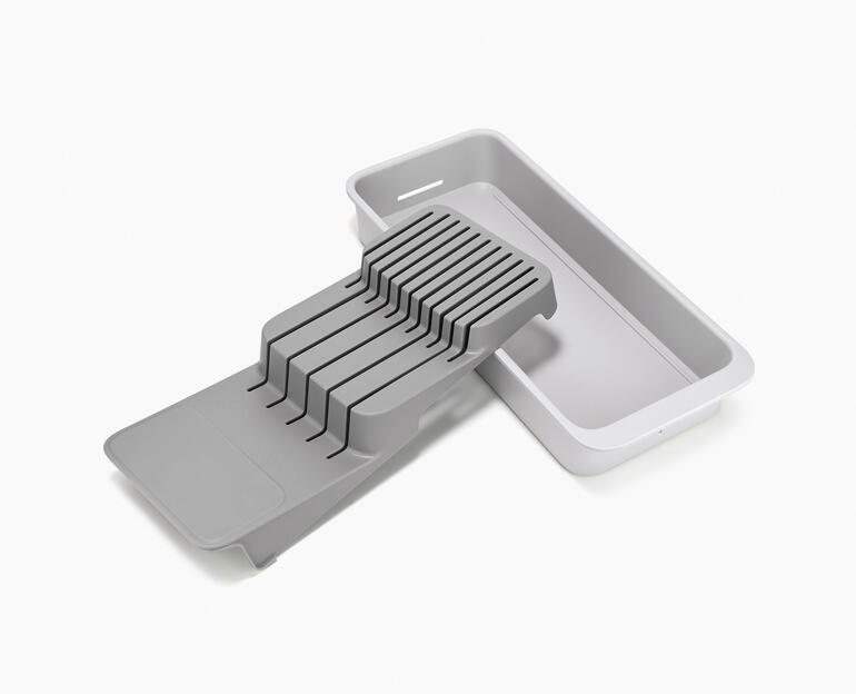 Messerorganizer mit seitlichen Einsätzen und grauer Basis.