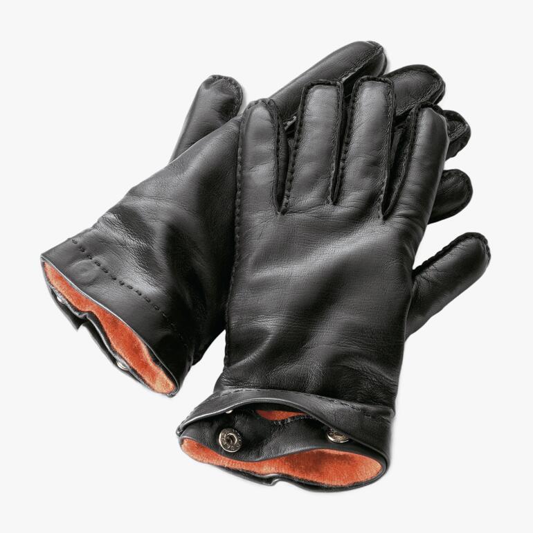 Schwarze Lederhandschuhe mit rotem Innenfutter.