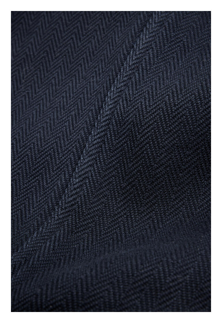 Navy Herringbone-Hose aus handgewebtem Stoff mit feiner Struktur.